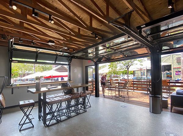 Stylish Commercial Garage Doors Open Up Restaurants' Option for Summer Dining